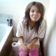 This poop video from Great Britain features a guy video-recording his pretty girlfriend as she shits while sitting on a toilet. Pooping sounds cannot be heard, but she must have gone because he comments about the smell.